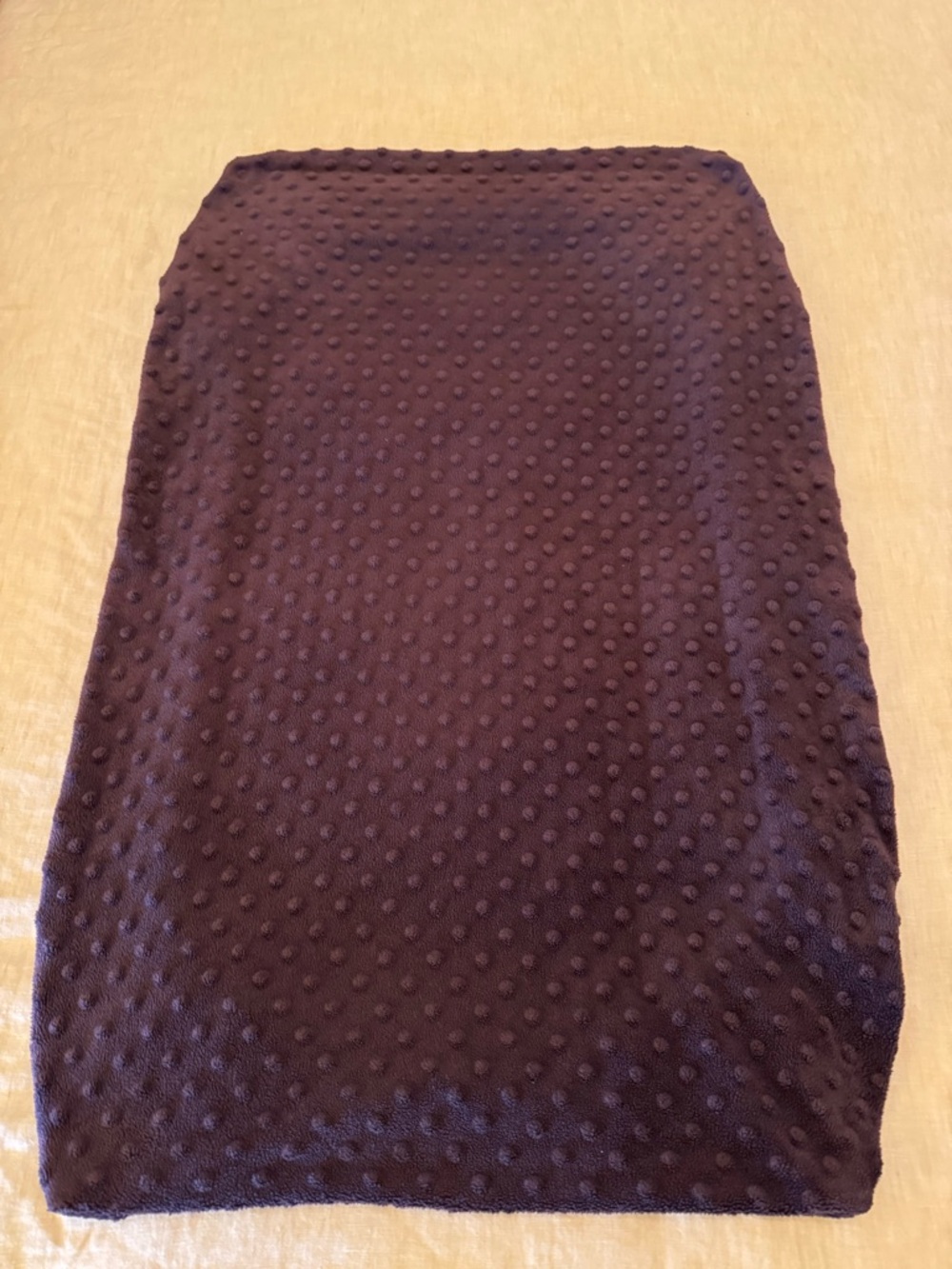 Carter’s textured brown baby changing pad cover